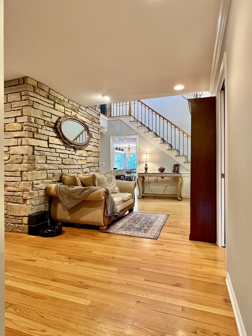 4111 Steeple Run Crystal Lake, IL 60014 - Photo 23 of 50 a living room with furniture and a wooden floor