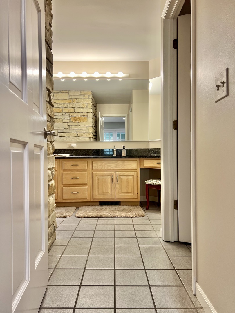 4111 Steeple Run Crystal Lake, IL 60014 - Photo 31 of 50 a kitchen with stainless steel appliances granite countertop a sink and cabinets