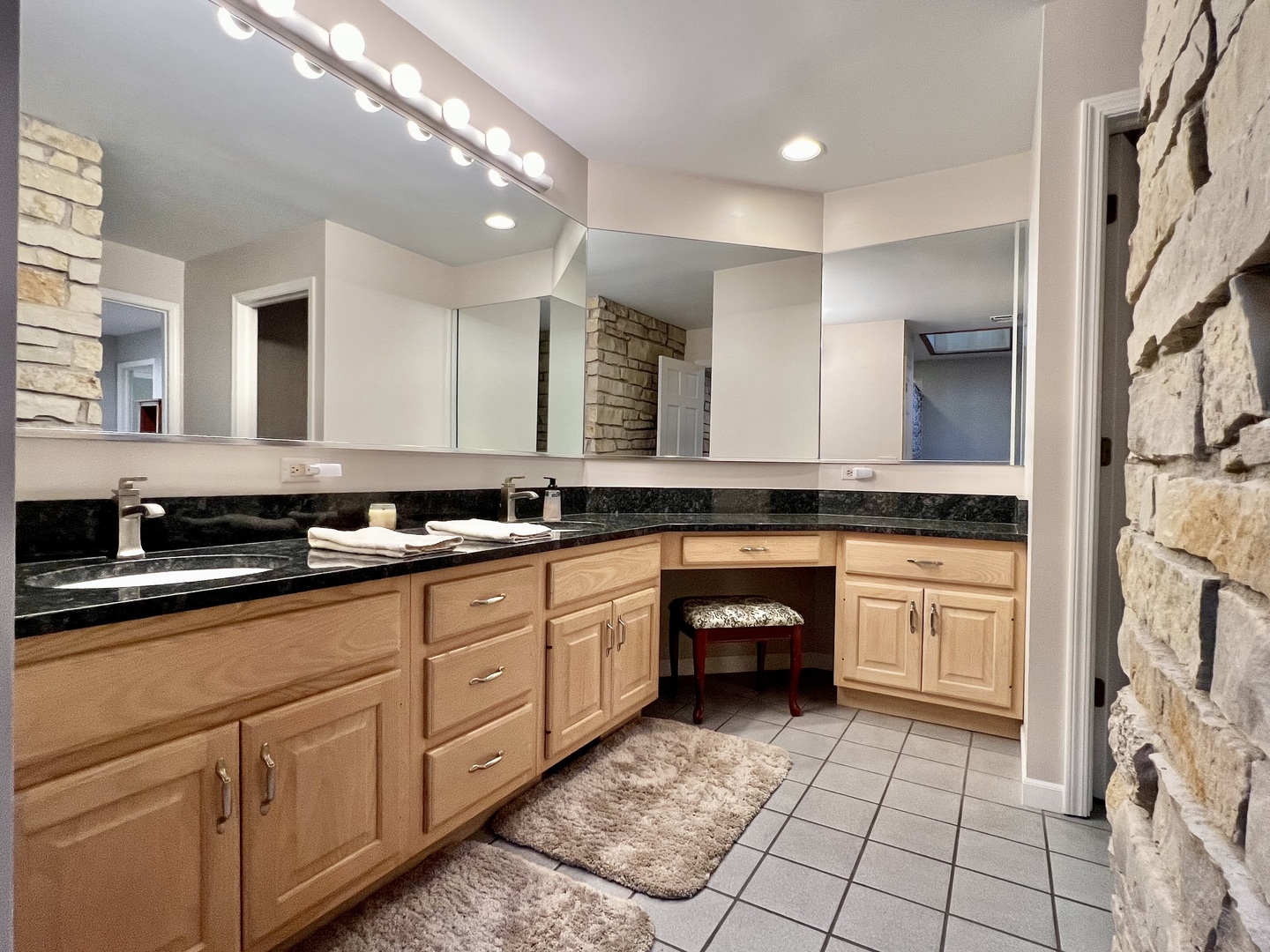 4111 Steeple Run Crystal Lake, IL 60014 - Photo 33 of 50 a spacious bathroom with a sink and a mirror