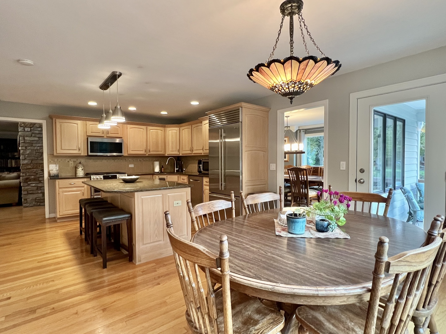 4111 Steeple Run Crystal Lake, IL 60014 - Photo 4 of 50 a view of a dining room with furniture wooden floor and chandelier