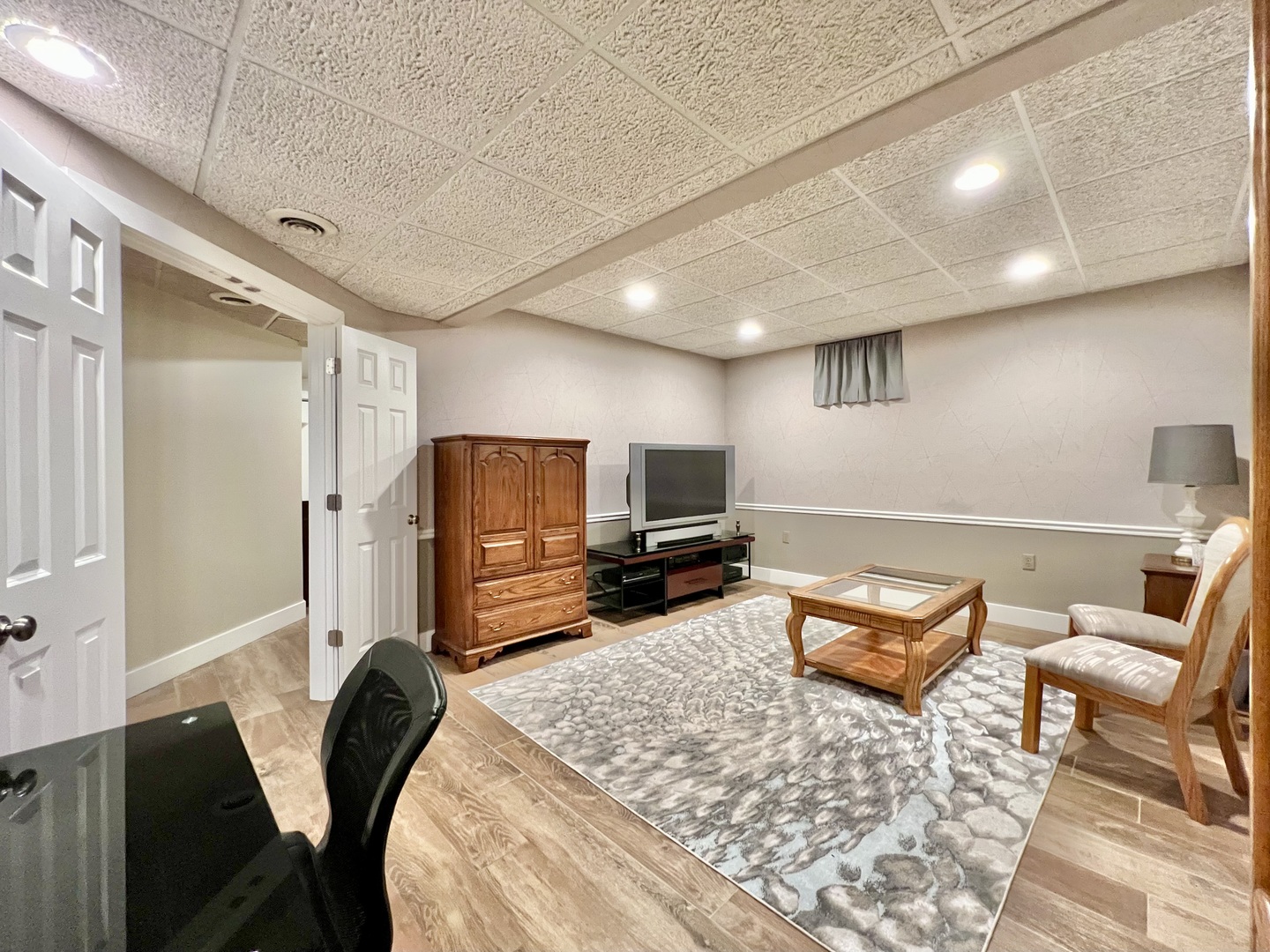 4111 Steeple Run Crystal Lake, IL 60014 - Photo 44 of 50 a living room with furniture and a flat screen tv