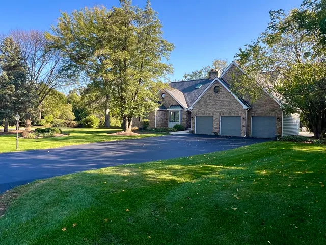 a view of a house with patio and sitting area