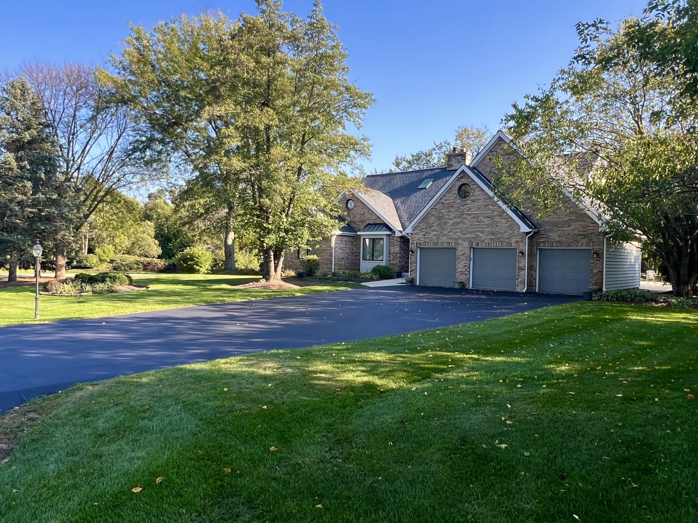4111 Steeple Run Crystal Lake, IL 60014 - Photo 46 of 50 a front view of a house with a yard