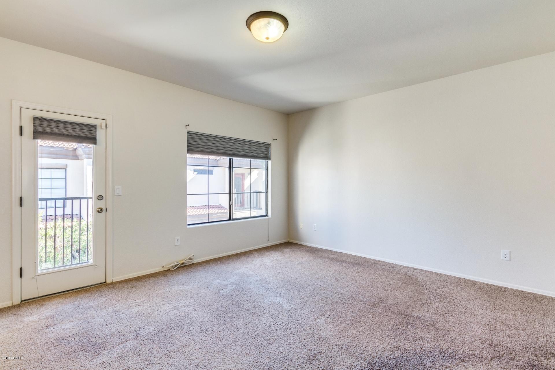 3150 East Beardsley Road, Unit 1031 Phoenix, AZ 85050 - Photo 17 of 27 Master Bedroom with juliette balcony