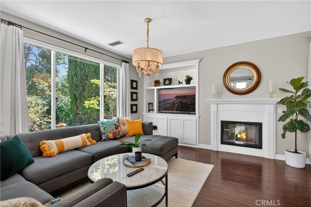 89 Dawnwood Ladera Ranch, CA 92694 - Photo 12 of 47 a living room with furniture a fireplace and a large window