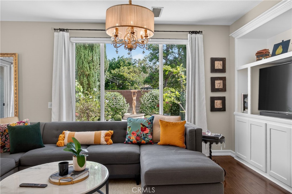 89 Dawnwood Ladera Ranch, CA 92694 - Photo 13 of 47 a living room with furniture a flat screen tv and a large window