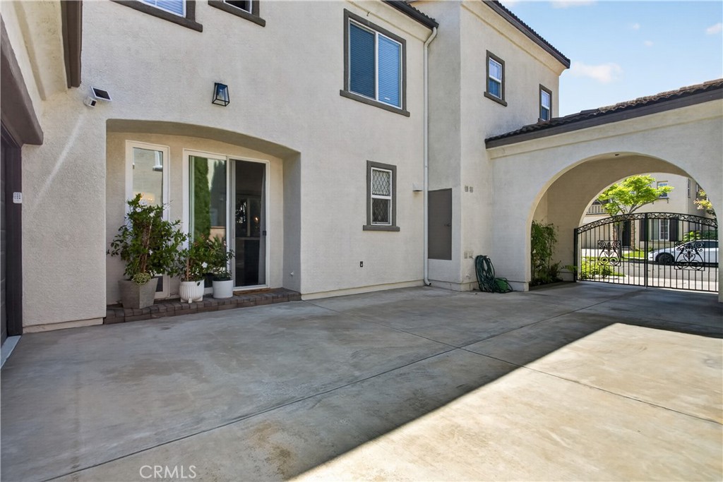 89 Dawnwood Ladera Ranch, CA 92694 - Photo 16 of 47 a view of a brick house with potted plants