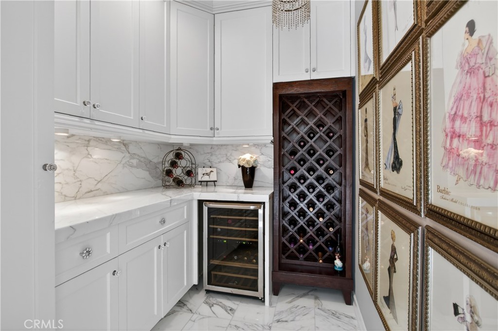 89 Dawnwood Ladera Ranch, CA 92694 - Photo 18 of 47 a kitchen with a refrigerator and cabinets