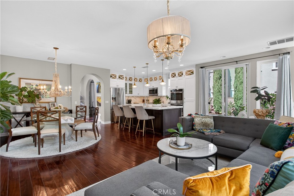 89 Dawnwood Ladera Ranch, CA 92694 - Photo 2 of 47 a living room with furniture a chandelier and a dining table