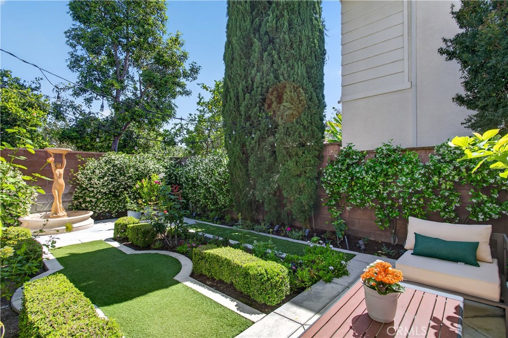 89 Dawnwood Ladera Ranch, CA 92694 - Photo 31 of 47 a view of a chair and tables in the backyard