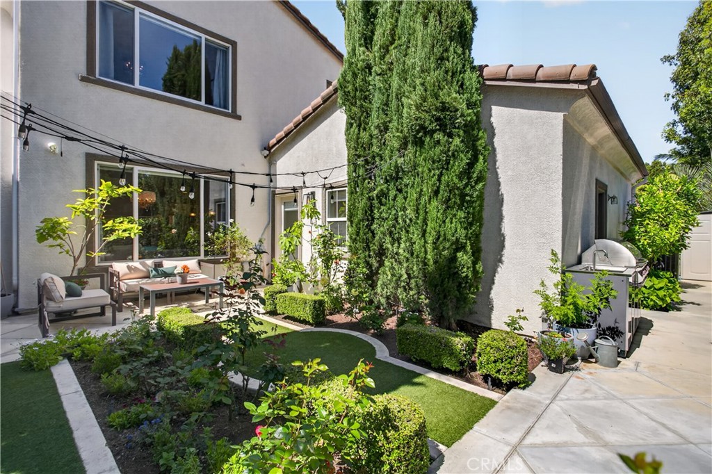 89 Dawnwood Ladera Ranch, CA 92694 - Photo 33 of 47 a view of a house with backyard sitting area and garden