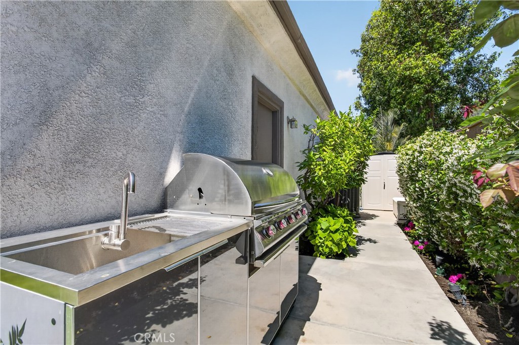 89 Dawnwood Ladera Ranch, CA 92694 - Photo 34 of 47 a backyard of a house with table and chairs plants