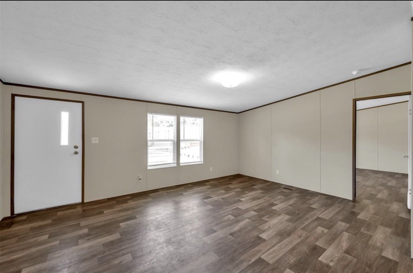 26768 B Dobbin-Huffsmith Road Magnolia, TX 77354 - Photo 9 of 21 an empty room with wooden floor and windows
