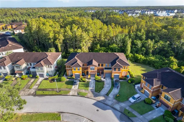 an aerial view of a house with a swimming pool