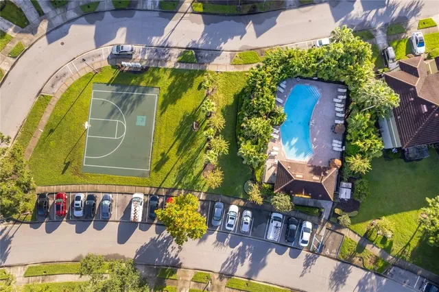 an aerial view of a house with a yard