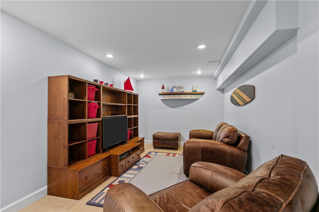 23 Clinton Street Newport, RI 02840 - Photo 31 of 45 Finished basement media/den with multiple closets
