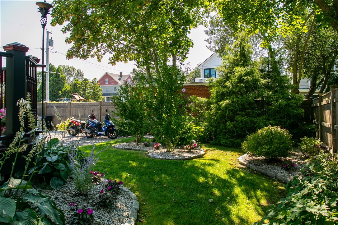 23 Clinton Street Newport, RI 02840 - Photo 35 of 45 Yard, lovely landscaping, and 2 scooters ready to take you around Ocean Drive...
