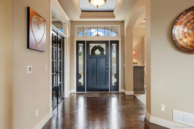 a view of an entryway with wooden floor