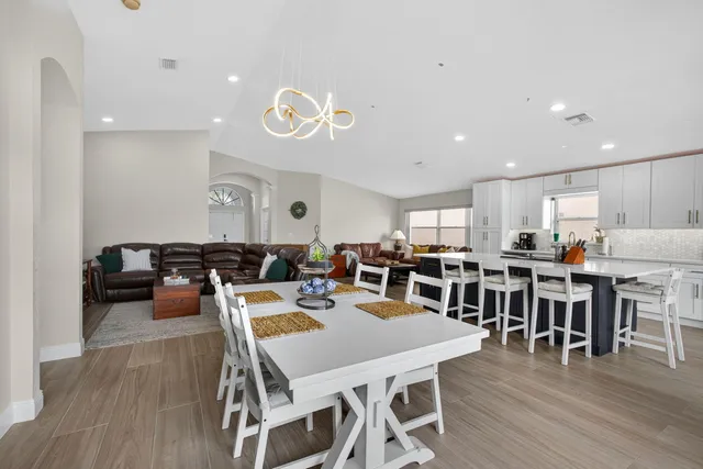 a view of a dining area with furniture and wooden floor