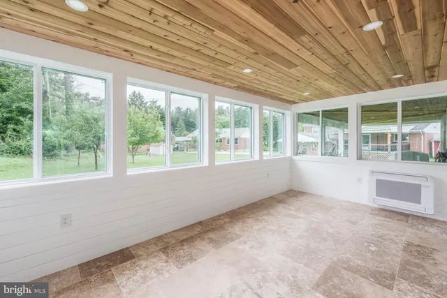 a balcony with wooden floor and fence