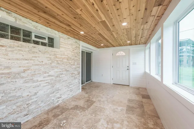 a view of a balcony with wooden floor