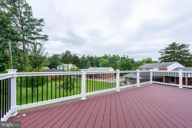 a view of house with backyard