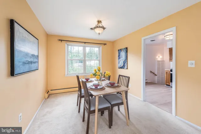 a dining room with furniture and window