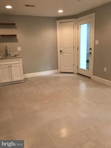 a view of an empty room and window