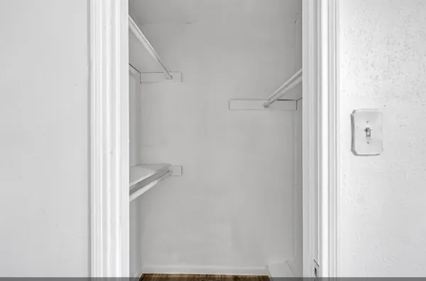 a bathroom with a sink double vanity granite tub shower and a mirror