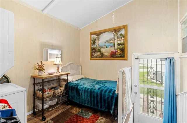 a bedroom with a bed and a table