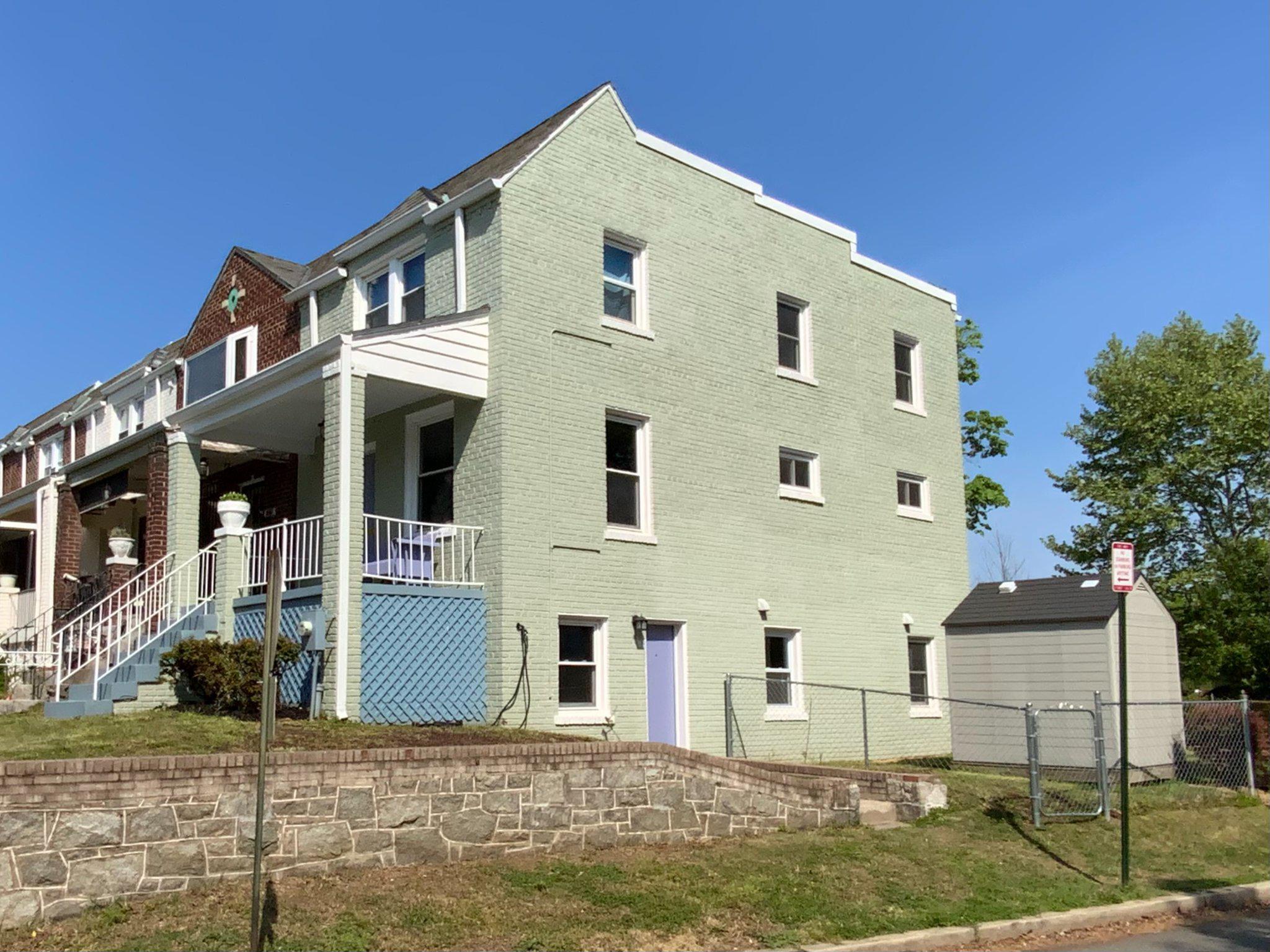 1772 E Street Northeast Washington, DC 20002 - Photo 1 of 23 a front view of a house with a yard