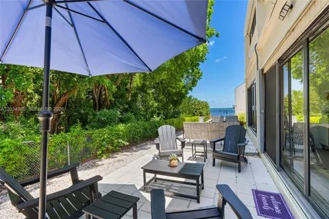 an aerial view of a house with a ocean view