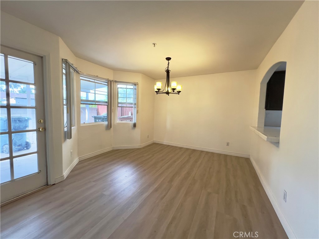 12143 Ferris Road El Monte, CA 91732 - Photo 19 of 41 wooden floor in an empty room with a window