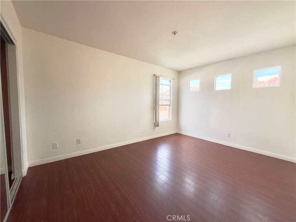12143 Ferris Road El Monte, CA 91732 - Photo 25 of 41 a view of an empty room with wooden floor and a window
