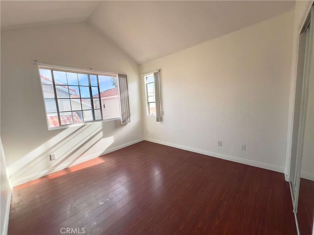 12143 Ferris Road El Monte, CA 91732 - Photo 26 of 41 an empty room with wooden floor and windows