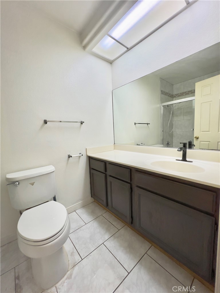 12143 Ferris Road El Monte, CA 91732 - Photo 30 of 41 a bathroom with a double vanity sink mirror and toilet