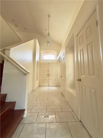 a view of a hallway with windows