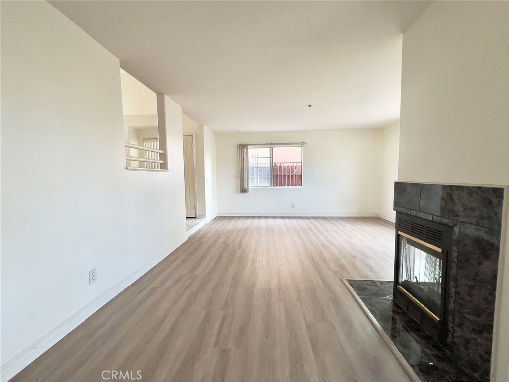 12143 Ferris Road El Monte, CA 91732 - Photo 10 of 41 wooden floor in an empty room with a window
