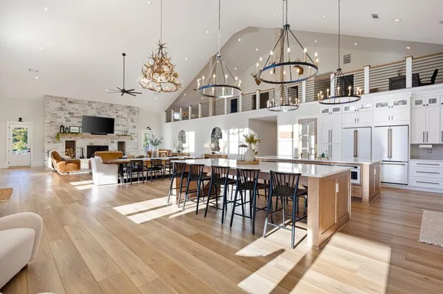a kitchen with stainless steel appliances cabinets and a window