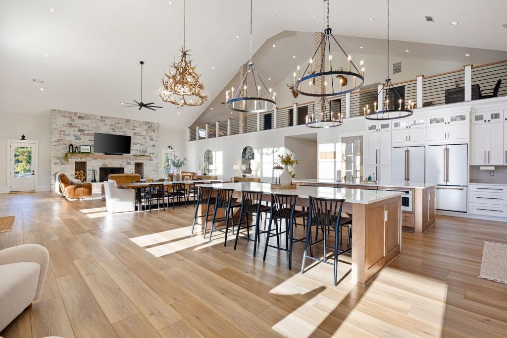 125 Perry Road Rydal, GA 30171 - Photo 11 of 139 a view of a dining room with furniture a chandelier and wooden floor