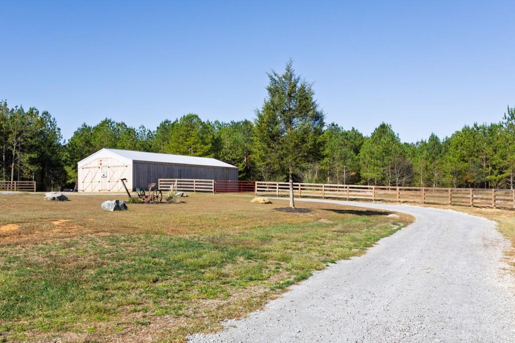 125 Perry Road Rydal, GA 30171 - Photo 112 of 139 a view of a swimming pool with an outdoor seating and a garden