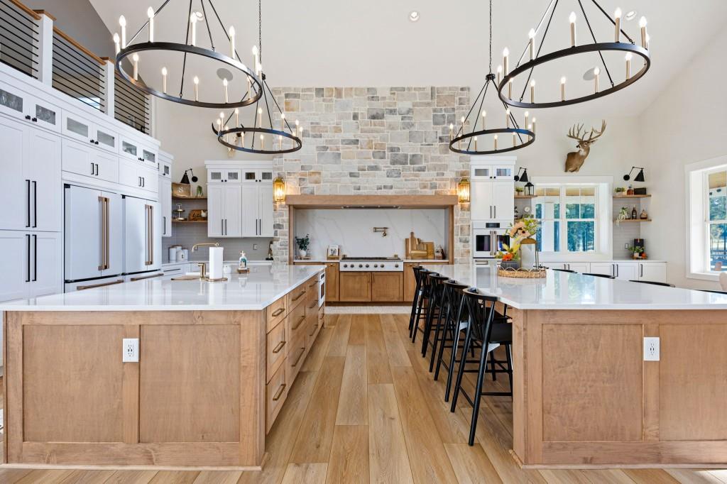 125 Perry Road Rydal, GA 30171 - Photo 16 of 139 a kitchen with stainless steel appliances granite countertop a sink a stove top oven a chimney and a bookshelf