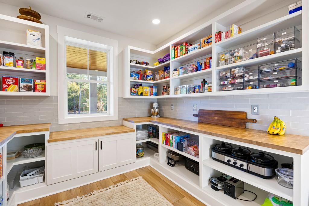 125 Perry Road Rydal, GA 30171 - Photo 26 of 139 a room with stainless steel appliances cabinets and a book shelf