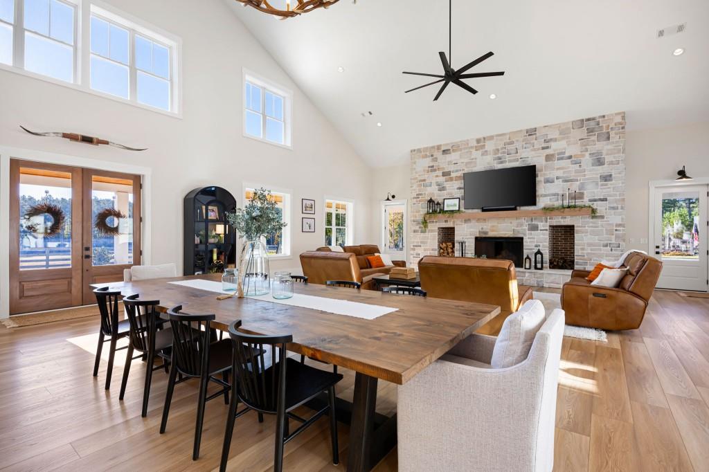 125 Perry Road Rydal, GA 30171 - Photo 28 of 139 a view of a dining room with furniture a fireplace and wooden floor