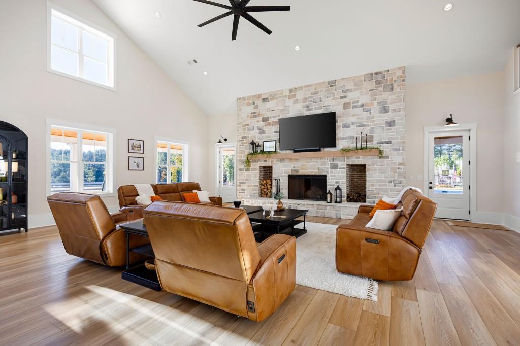 125 Perry Road Rydal, GA 30171 - Photo 32 of 139 a living room with furniture a flat screen tv and a fireplace