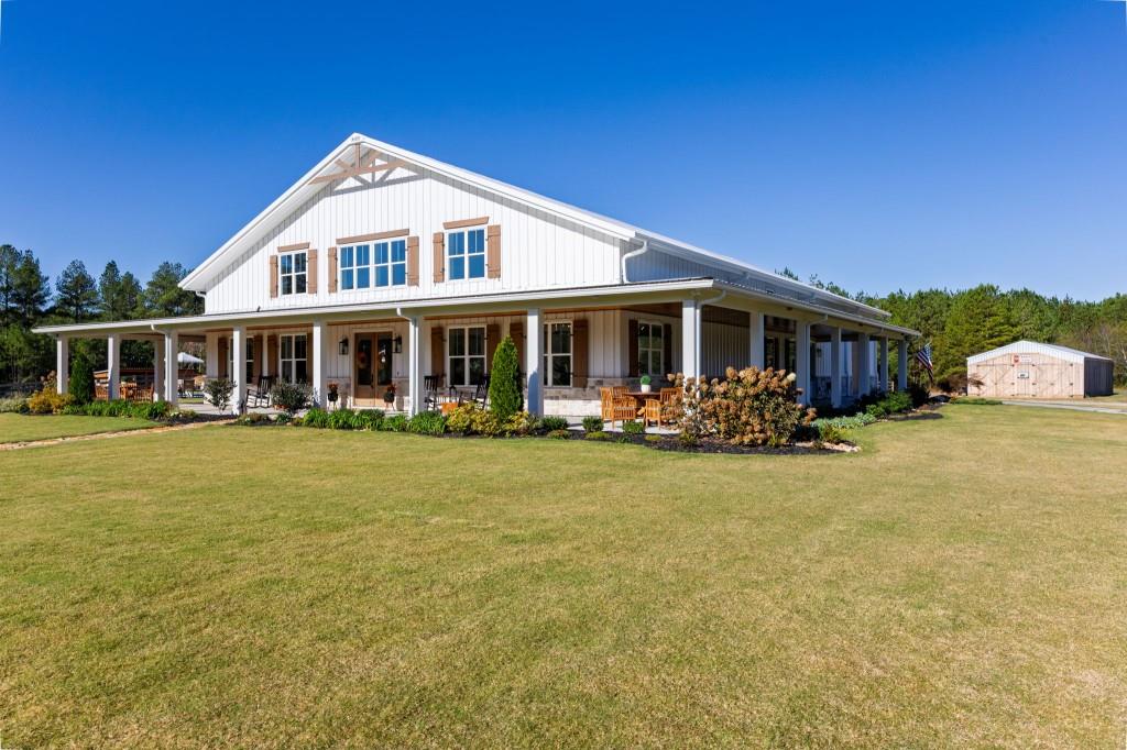 125 Perry Road Rydal, GA 30171 - Photo 4 of 139 a front view of a house with swimming pool having outdoor seating