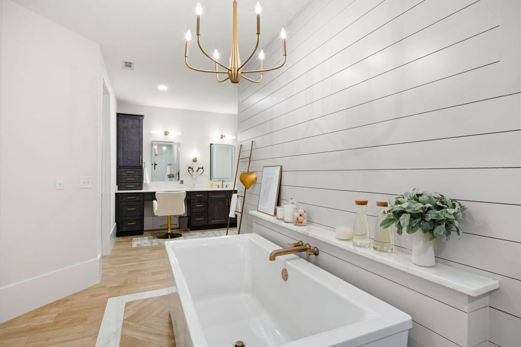 125 Perry Road Rydal, GA 30171 - Photo 44 of 139 a bathroom with a sink and a large mirror