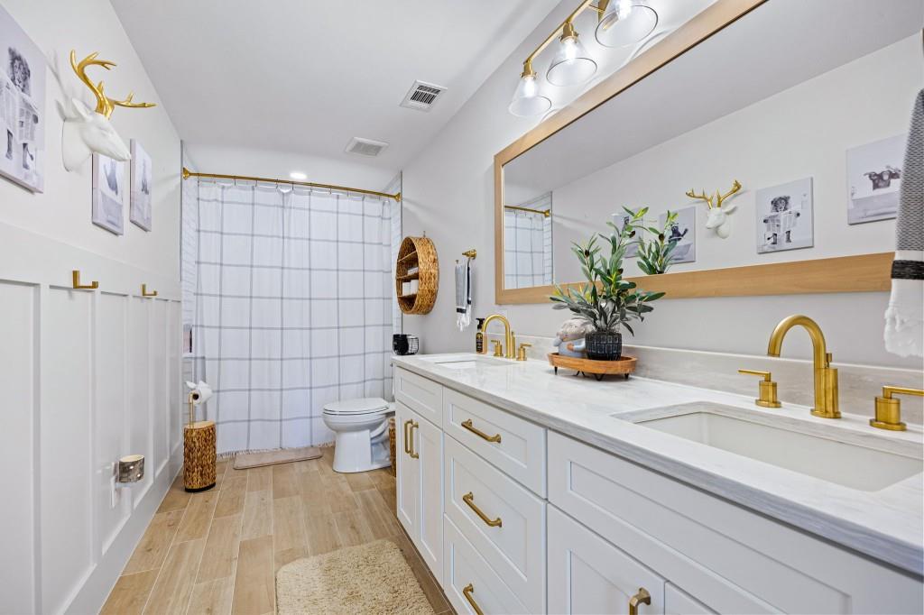 125 Perry Road Rydal, GA 30171 - Photo 65 of 139 a bathroom with a double vanity sink toilet and shower