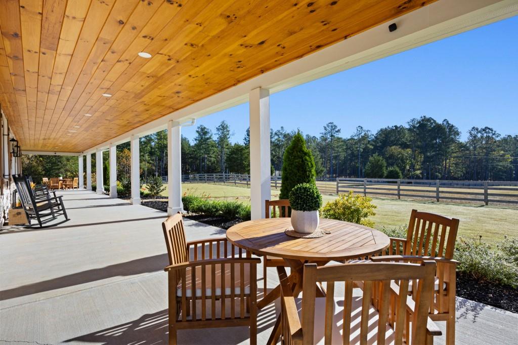 125 Perry Road Rydal, GA 30171 - Photo 84 of 139 a view of a patio with a table chairs and a backyard