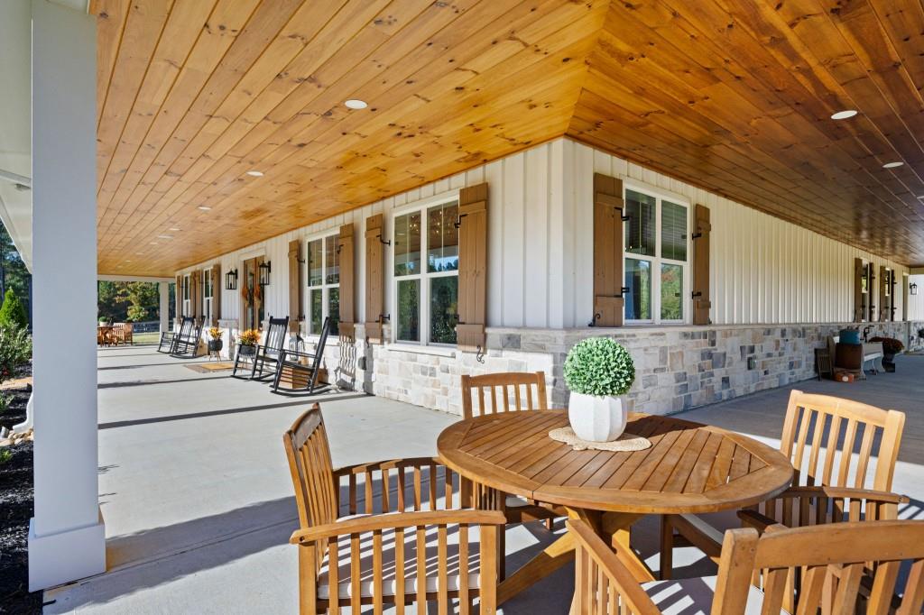 125 Perry Road Rydal, GA 30171 - Photo 85 of 139 a view of a patio with couches table and chairs and potted plants